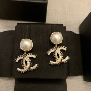 Chanel pearl earrings with gold, black and crystal accents.